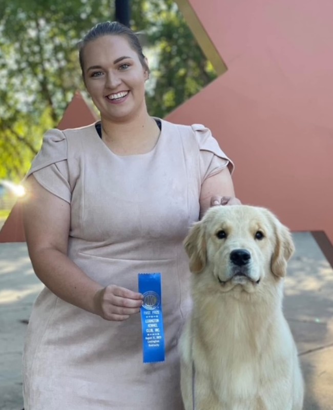 Chloe women standing with pet outside
